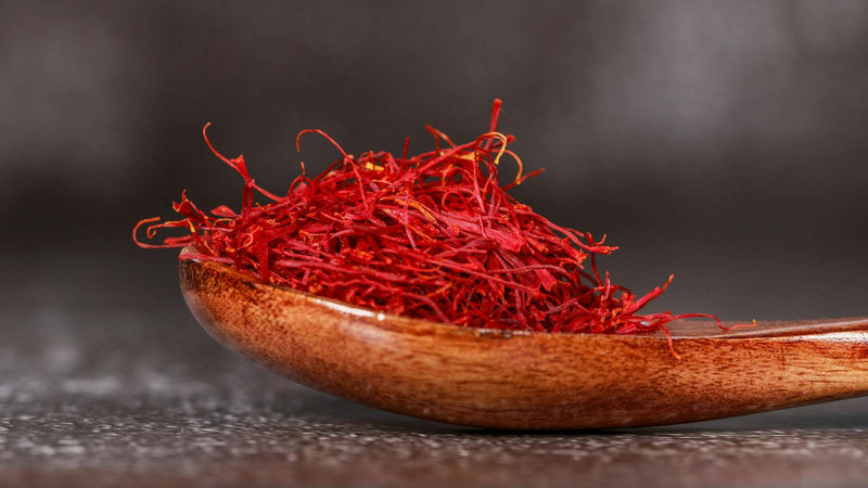 Sealed glass bottle of saffron threads stored in a dark cabinet — Raihan Afghan Super Negin saffron