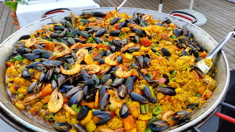 Seafood paella with saffron, mussels, and shrimp