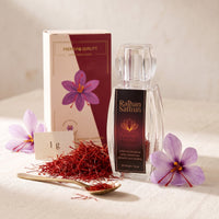 Raihan Saffron 1 g: Afghan Super Negin saffron crystal bottle and gift box with whole red saffron threads and crocus flowers on ivory linen