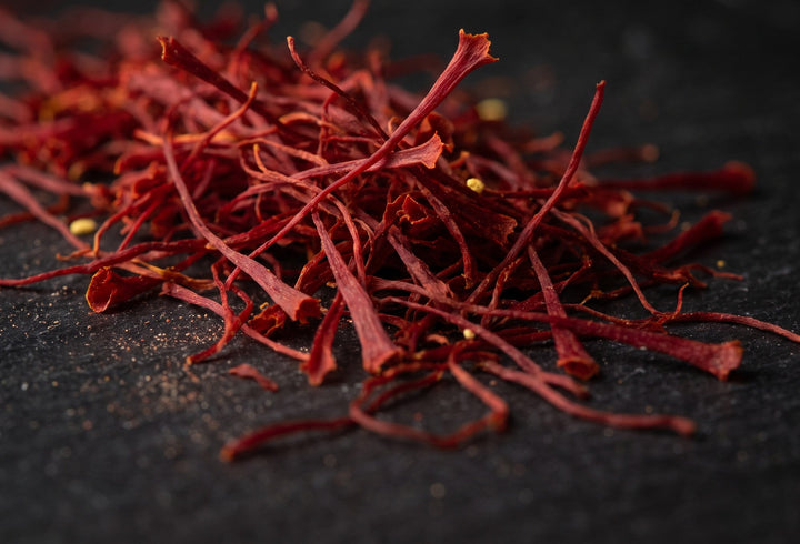 Whole red Super Negin saffron threads on black slate